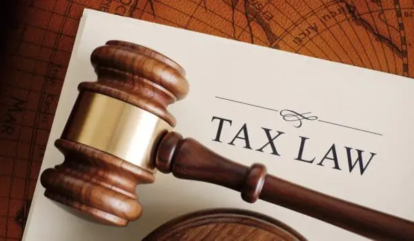 gavel atop a document titled "tax law"